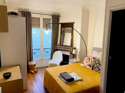 Un ou plusieurs lits dans un hébergement de l'établissement Nice and cosy apartment Ménilmontant