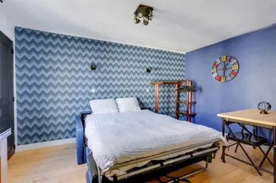 Un ou plusieurs lits dans un hébergement de l'établissement Bluestay 11 - Charmant Studio au Cœur de Paris
