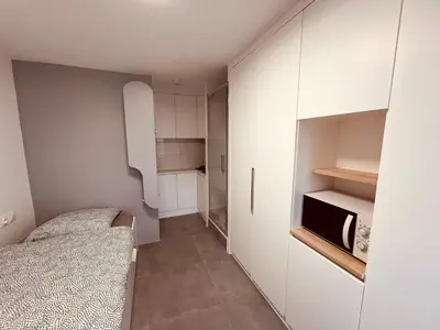 Un ou plusieurs lits dans un hébergement de l'établissement Charming Studio near Châtelet Saint Sauveur