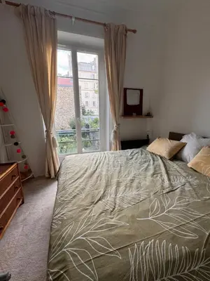 Un ou plusieurs lits dans un hébergement de l'établissement Appartement 2 pièces charmant et paisible vue sur jardin