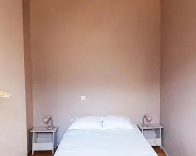 Un ou plusieurs lits dans un hébergement de l'établissement Cœur Du Marais - Grand appartement 2 chambres