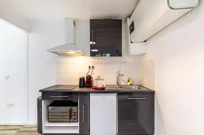 Cuisine ou kitchenette dans l'établissement GuestReady - Central Apt in Paris