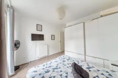 Un ou plusieurs lits dans un hébergement de l'établissement Appartement Chic