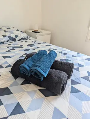 Un ou plusieurs lits dans un hébergement de l'établissement Appartement Chic