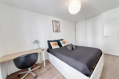 Un ou plusieurs lits dans un hébergement de l'établissement Appartement Elégant