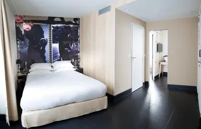 Un ou plusieurs lits dans un hébergement de l'établissement Hotel L’Antoine