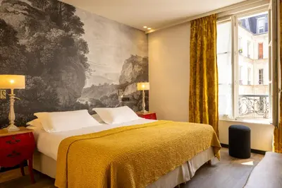 Un ou plusieurs lits dans un hébergement de l'établissement Hotel L’Antoine