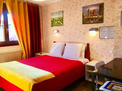 Un ou plusieurs lits dans un hébergement de l'établissement Hotel Paris Star
