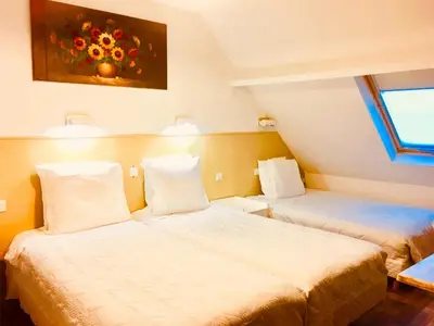 Un ou plusieurs lits dans un hébergement de l'établissement Hotel Paris Star