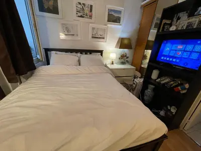 Un ou plusieurs lits dans un hébergement de l'établissement Appartement Paris Gare du nord