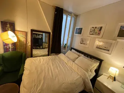 Un ou plusieurs lits dans un hébergement de l'établissement Appartement Paris Gare du nord