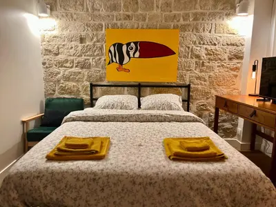 Un ou plusieurs lits dans un hébergement de l'établissement Studio des Tuileries