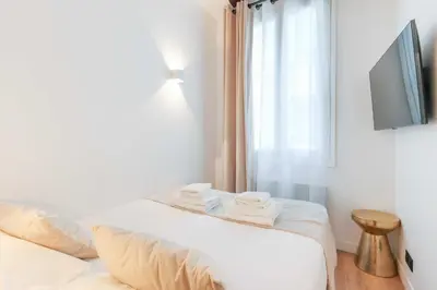 Un ou plusieurs lits dans un hébergement de l'établissement Relaxing Urban Getaway, Notre Dame