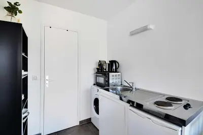 Cuisine ou kitchenette dans l'établissement Stunning studio - 2P - La Vilette