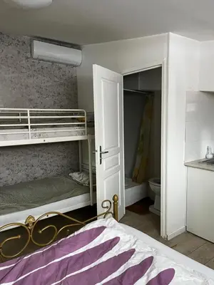 Un ou plusieurs lits dans un hébergement de l'établissement Chez Mia Paris