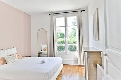 Un ou plusieurs lits dans un hébergement de l'établissement Appartement lumineux - Puteaux - II