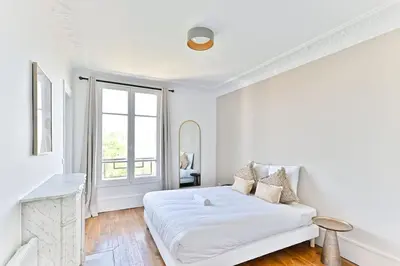 Un ou plusieurs lits dans un hébergement de l'établissement Appartement lumineux - Puteaux - II