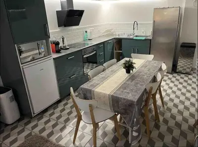 Cuisine ou kitchenette dans l'établissement M2 Appart 3 chambres 5 min metro - PARC EXPO