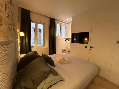 Un ou plusieurs lits dans un hébergement de l'établissement Louvre -Notre Dame 2BD, 2BATH AC