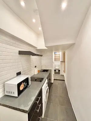 Cuisine ou kitchenette dans l'établissement Cozy Apartment Near Bastille & Marais