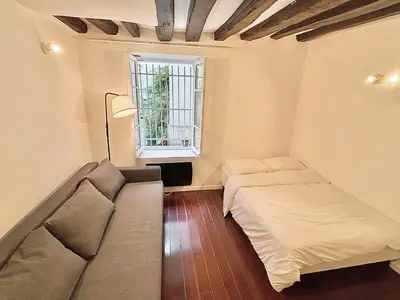 Un ou plusieurs lits dans un hébergement de l'établissement Cozy Apartment Near Bastille & Marais