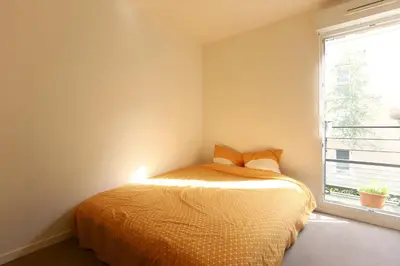 Un ou plusieurs lits dans un hébergement de l'établissement Private room in shared house
