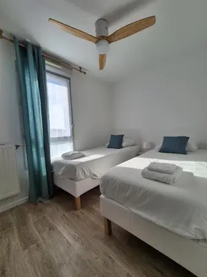 Un ou plusieurs lits dans un hébergement de l'établissement Appartement Les Portes du Stade