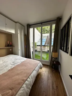 Un ou plusieurs lits dans un hébergement de l'établissement Appartement avec terrasse
