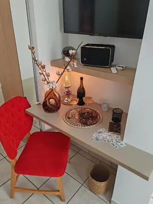 Télévision ou salle de divertissement dans l'établissement Nid douillet et lumineux