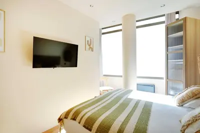 Un ou plusieurs lits dans un hébergement de l'établissement Refurbished Apartment - 2BD-8P - Place D'Italie