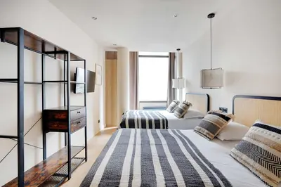 Un ou plusieurs lits dans un hébergement de l'établissement Refurbished Apartment - 2BD-8P - Place D'Italie