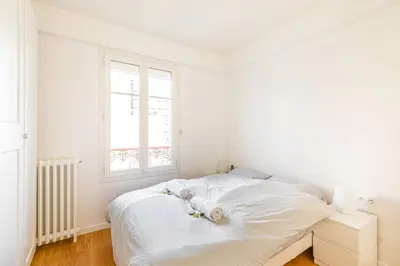 Un ou plusieurs lits dans un hébergement de l'établissement GuestReady - Confort familial avec balcon