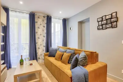 Coin salon dans l'établissement Bel appartement - 2 chambres au centre de Paris