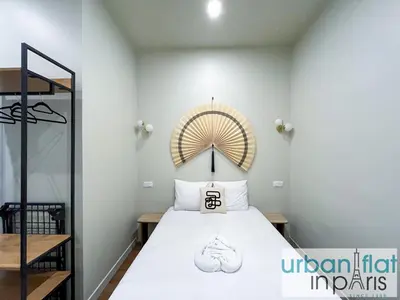 Un ou plusieurs lits dans un hébergement de l'établissement Urban Flat 188 - Sublime 4 Bedroom Apartment in Paris