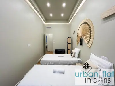 Un ou plusieurs lits dans un hébergement de l'établissement Urban Flat 188 - Sublime 4 Bedroom Apartment in Paris