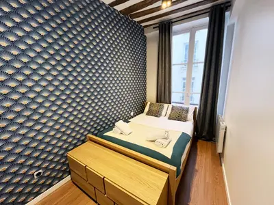 Un ou plusieurs lits dans un hébergement de l'établissement Urban Flat 108 - Stunning 4 BDR Flat in Paris