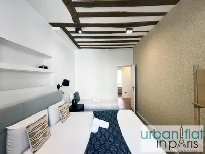 Un ou plusieurs lits dans un hébergement de l'établissement Urban Flat 108 - Stunning 4 BDR Flat in Paris