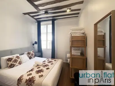 Un ou plusieurs lits dans un hébergement de l'établissement Urban Flat 108 - Stunning 4 BDR Flat in Paris