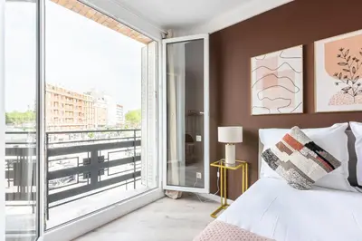 Un ou plusieurs lits dans un hébergement de l'établissement Studio lumineux Paris Est -II