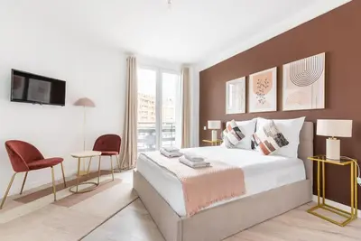Un ou plusieurs lits dans un hébergement de l'établissement Studio lumineux Paris Est -II