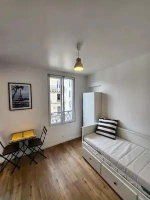 Un ou plusieurs lits dans un hébergement de l'établissement Superbe studio à MONTMARTRE
