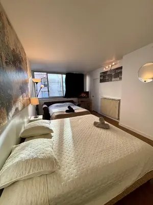 Un ou plusieurs lits dans un hébergement de l'établissement Appartement des Champs Elysées