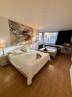 Un ou plusieurs lits dans un hébergement de l'établissement Appartement des Champs Elysées