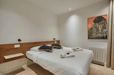 Un ou plusieurs lits dans un hébergement de l'établissement Apartment Le Marais Centre de Paris by Studio Prestige