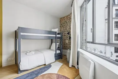 Un ou plusieurs lits dans un hébergement de l'établissement Amazing Montorgueil