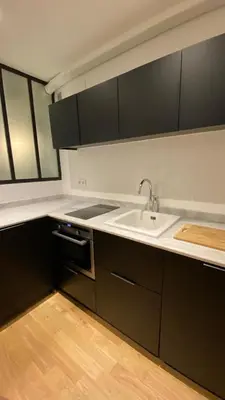 Cuisine ou kitchenette dans l'établissement Joli studio au cœur de Paris