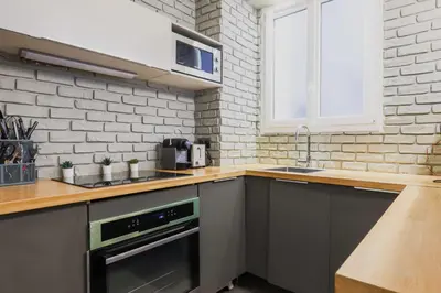 Cuisine ou kitchenette dans l'établissement Modern flat - 1BD-4P - Parc Monceau