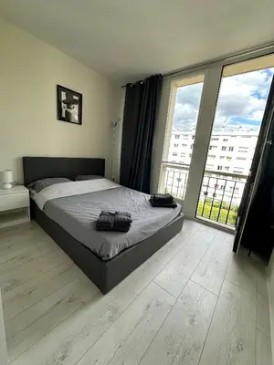 Un ou plusieurs lits dans un hébergement de l'établissement Appart ensoleillé à Boulogne Billancourt