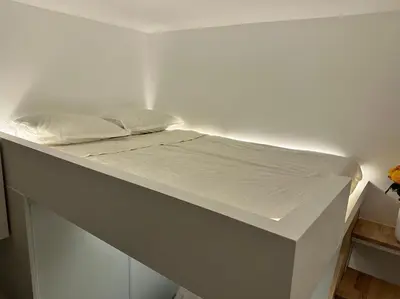 Un ou plusieurs lits dans un hébergement de l'établissement Studio Metro Paris La-defense