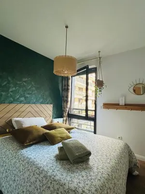 Un ou plusieurs lits dans un hébergement de l'établissement Les Chambres de David